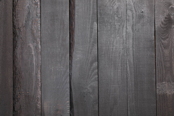 Dark wooden background. Texture for your design. Space for text - Foto, afbeelding