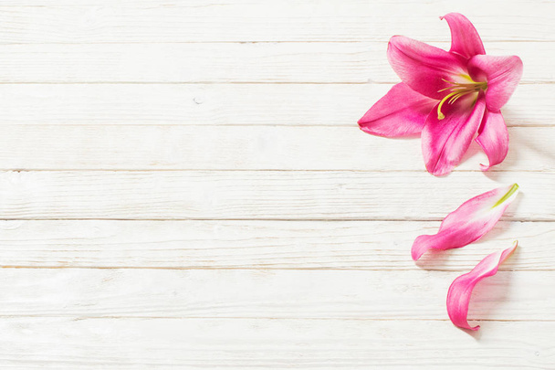 pink lily flowers on white wooden background - Foto, Imagem