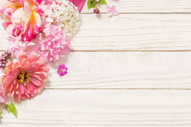 pink flowers on white wooden background - Zdjęcie, obraz