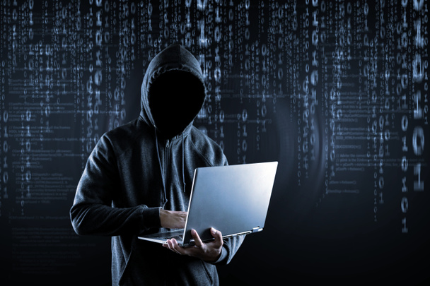 Cyberprzestępczość, hacking i przestępczości technologicznej. nie twarz Hacker z La - Zdjęcie, obraz