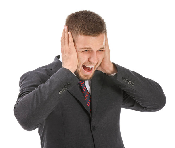 Businessman having panic attack on white background - Foto, afbeelding