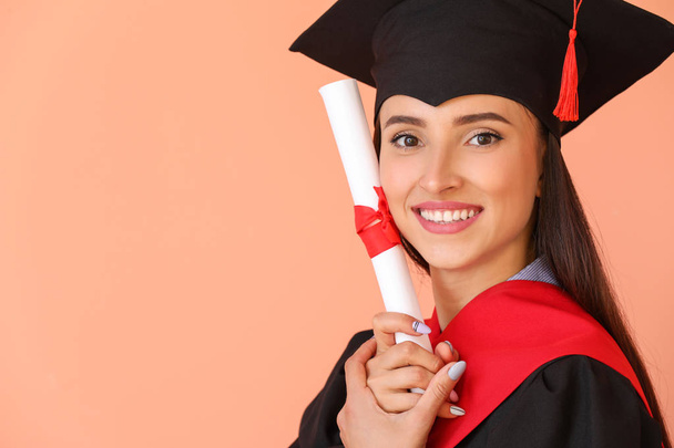 Female graduate with diploma on color background - Foto, immagini