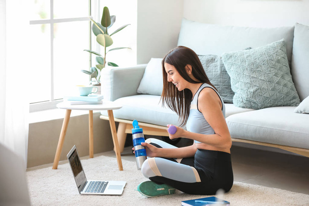 Female sport blogger with laptop at home - Photo, Image
