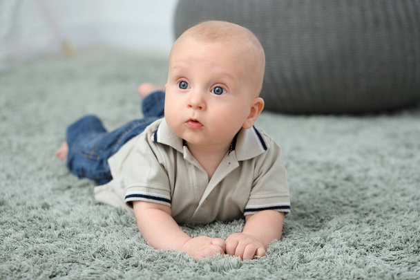 Adorable little baby crawling on soft carpet - Valokuva, kuva