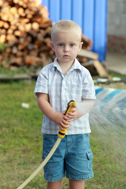 Little boy watering the lawn - Foto, Imagem