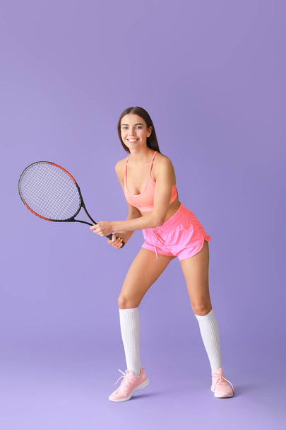 Beautiful tennis player on color background - Valokuva, kuva