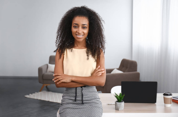 Portrait of beautiful African-American businesswoman in office - Photo, Image