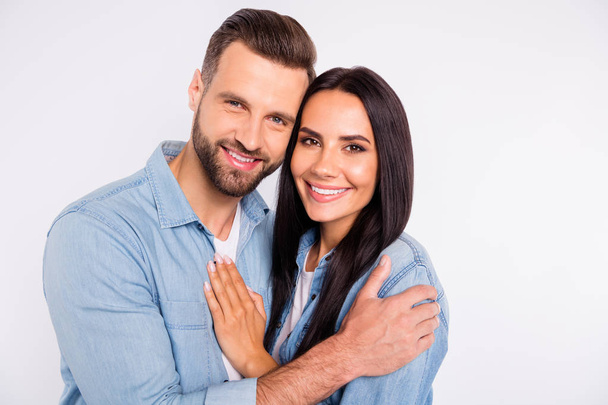Close up photo of charming spouses hugging with toothy smile isolated over white background - Φωτογραφία, εικόνα