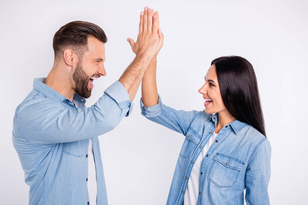 Profile side view portrait of his he her she nice attractive lovely charming cute cheerful cheery glad persons giving high-five accomplishment isolated over light white pastel background - Foto, Imagen