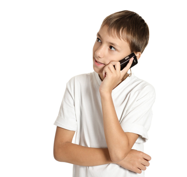 Portrait of a teenage boy speaking cellphone - Фото, зображення