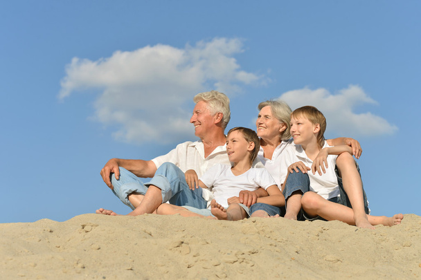 Big happy family relaxing on the sand together - Photo, Image
