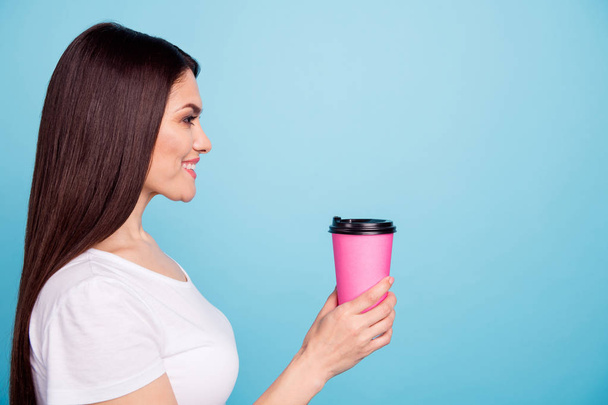 Photo of nice charming cute attractive cheerful girlfriend drinking coffee during her break while isolated with blue background - Foto, afbeelding