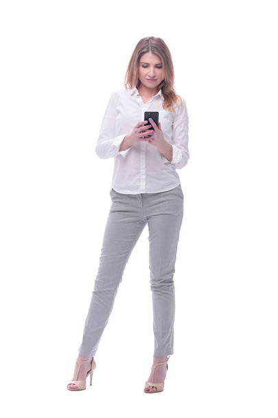 smiling business woman reading e-mail on her smartphone. isolated on white - Foto, Imagem