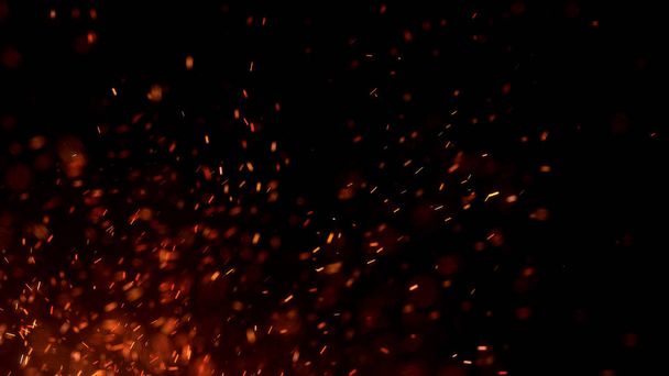 Hořící žhavé jiskry létají z velkého ohně na noční obloze. Krásné abstraktní pozadí na téma oheň, světlo a život. Hořící uhlíky zářící odlétající částice na černém pozadí. - Fotografie, Obrázek
