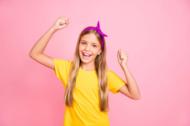 Photo of encouraged ecstatic girl winning some competitions while isolated with pink background - Фото, изображение