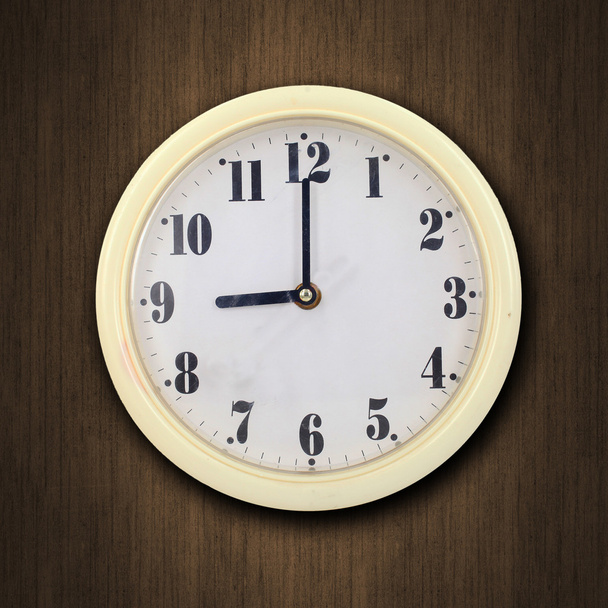 wall clock on the wood background - 写真・画像