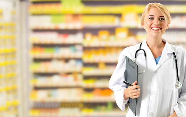 Woman pharmacist working at pharmacy. - Photo, Image
