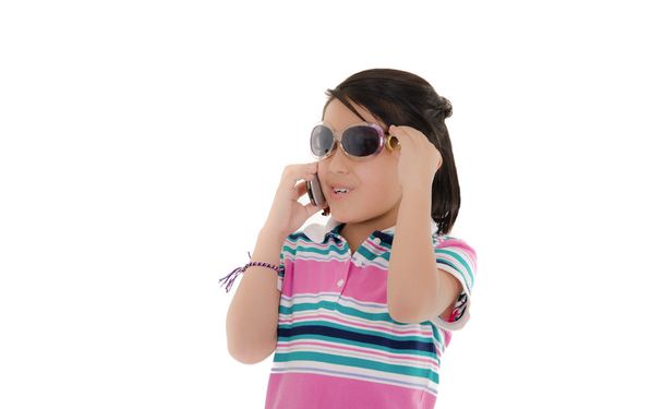 Cute smiling little hispanic girl in sunglasses over white - 写真・画像