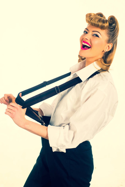 Suspenders. Business style for woman. Happy business lady. Emotions of success. Young girl in the office. - 写真・画像