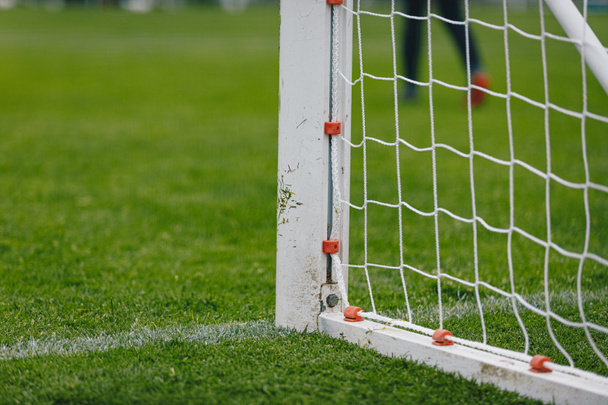 Football soccer goal. Post of football goal and white net in the foreground - Fotoğraf, Görsel