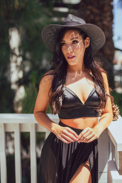 Tall mixed race woman in summer fashion poses outdoors - Photo, Image