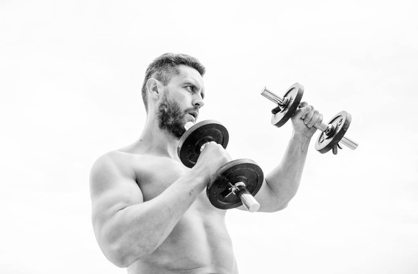 Gym workout. Workout fitness sport. Workout concept. Healthy mind in a healthy body. Muscular man exercising with dumbbell. Dumbbell exercise. Dare to be great. Sportsman strong biceps triceps - Foto, Imagem
