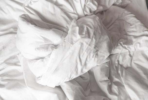 Messy bed in bedroom - Valokuva, kuva