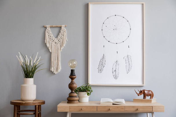 Stylish and boho concept of living room with mock up poster frame,  wooden desk, gray macrame and elegant accessories. Modern interior design. Nice home decor. Template - Foto, Imagen