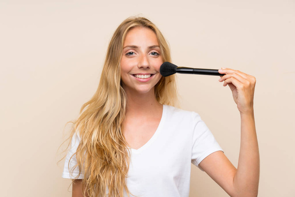 Happy Young blonde woman with makeup brus - Fotoğraf, Görsel