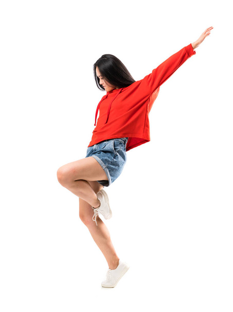 Young asian dancer over isolated white background - Photo, image