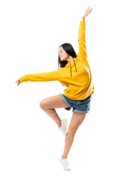 Young asian dancer over isolated white background - Φωτογραφία, εικόνα