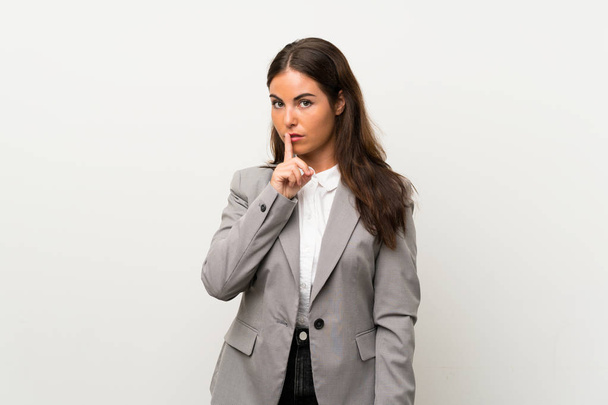 Young business woman over isolated white background doing silence gesture - Foto, Imagem