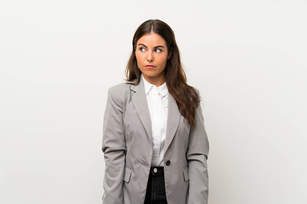 Young business woman over isolated white background standing and looking to the side - Fotografie, Obrázek
