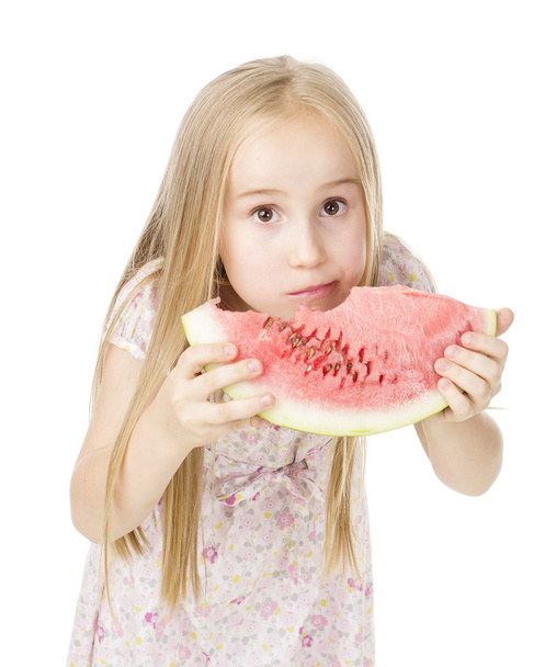 girl in a dress eating watermelon - Foto, imagen