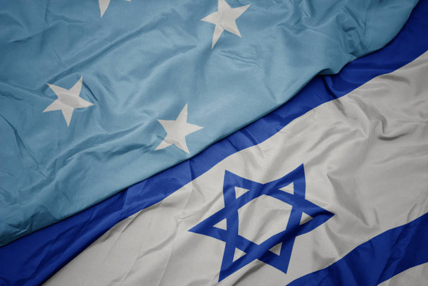 waving colorful flag of israel and national flag of Federated States of Micronesia . - Photo, Image