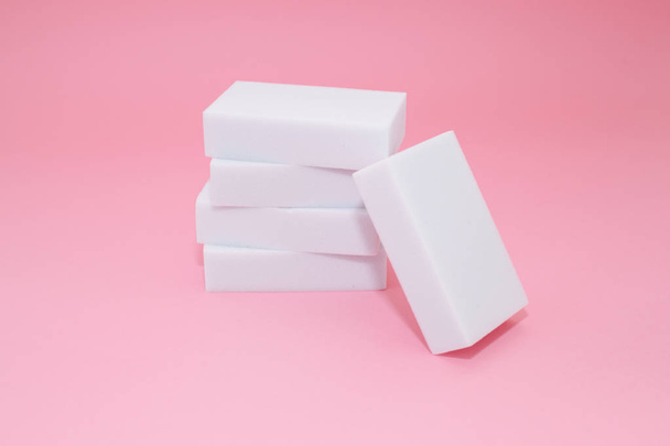 Melamine sponge stack on pink background - Фото, изображение