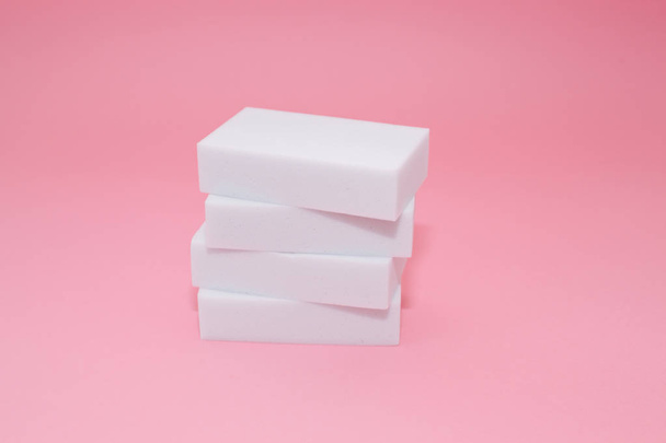Melamine sponge stack on pink background - Fotó, kép