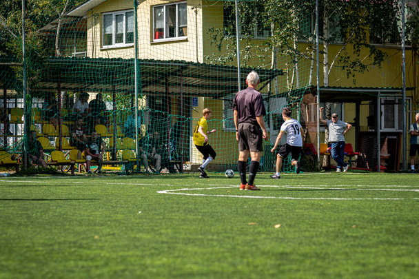 MOSCOW, RUSSIA - AUGUST 24, 2019: Soccer players in game. Amateur league in Moscow. - Photo, Image