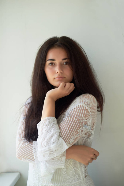 A girl with dark eyebrows ,brown eyes and dark hair. Natural beauty. Thick wide eyebrows. Natural beauty - Zdjęcie, obraz