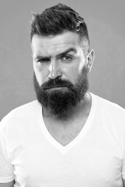 Beard fashion and barber concept. Strict and serious. Man bearded hipster stylish beard turquoise background. Barber tips maintain beard. Stylish beard and mustache care. Hipster appearance - Fotoğraf, Görsel