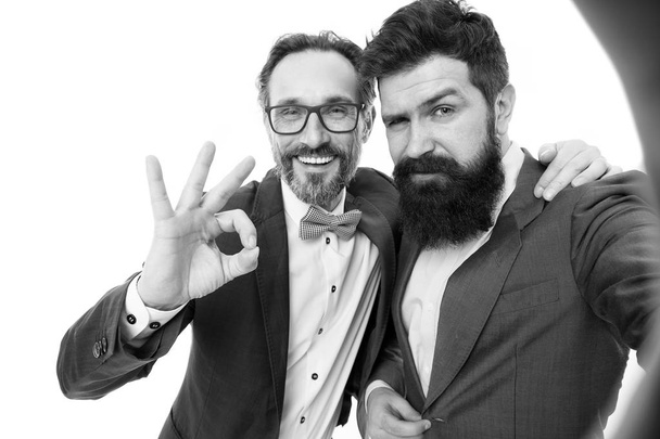 With good old friend. Men successful entrepreneurs on white background. Join our business team. Business people concept. Men bearded stylish guys wear formal suits. Well groomed business man - Foto, Bild