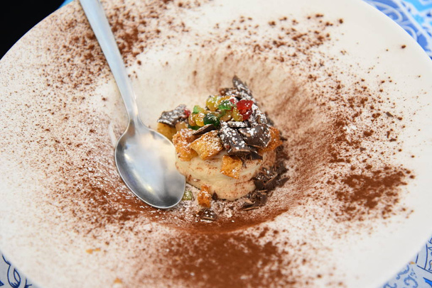 Gourmet restaurant sweet in the plate with chocolate dust - Photo, Image