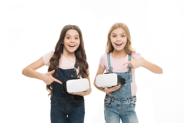Cyber gaming. Virtual reality is exciting. Girls little kids wear vr glasses white background. Virtual education concept. Modern life. Interaction in virtual space. Augmented reality technology - Photo, image