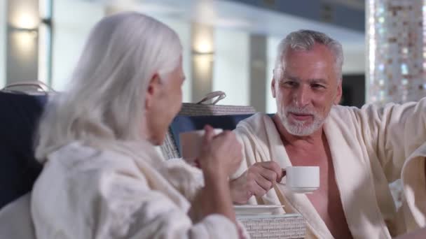 Happy mature couple during leisure in luxury hotel - Πλάνα, βίντεο