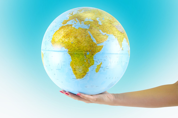 Earth globus in hand, various background - Φωτογραφία, εικόνα