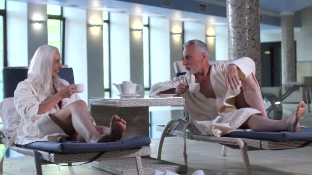 Happy aging couple spending vacation in spa hotel - Footage, Video