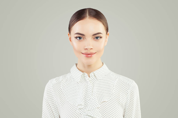 Cute young business woman portrait. Smart businesswoman in white - Photo, Image