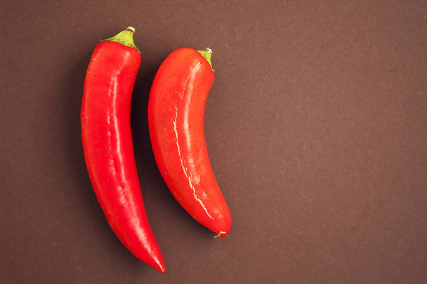 red chili peppers on brown background - Photo, image