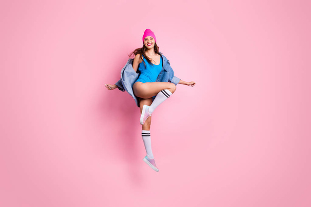 Full length photo of cheerful youth jumping enjoying wearing blue swim suit body suit isolated over pink background - Photo, Image