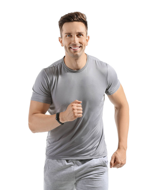 Running young man on white background - Foto, imagen